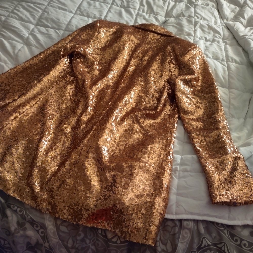 Gold glittery jacket the brand name is in Chinese